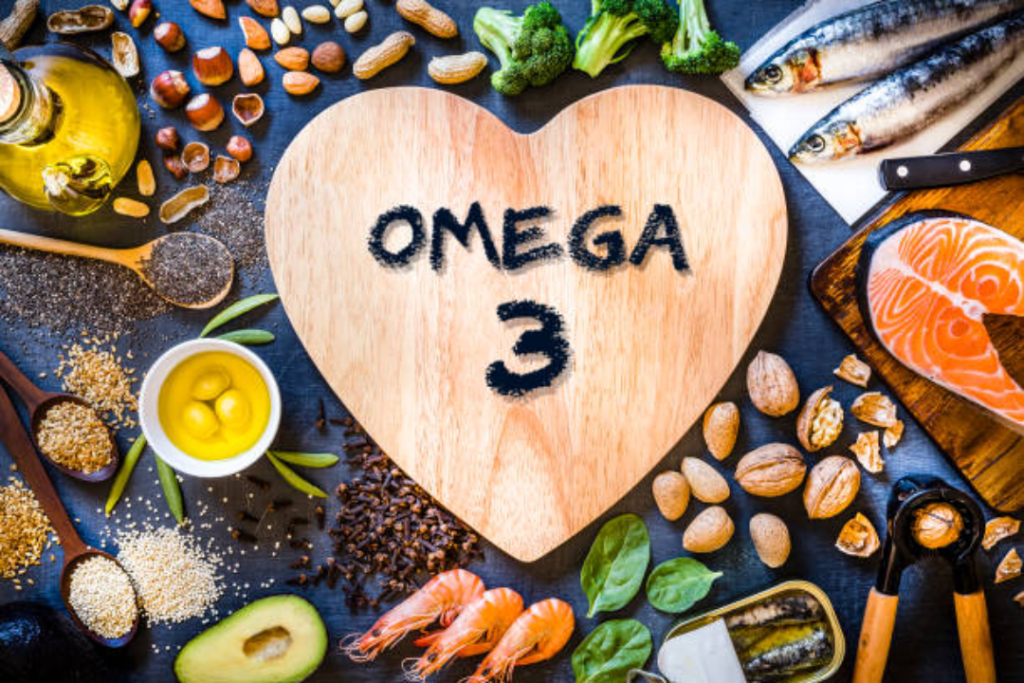 Image d'aliments contenant des oméga-3 avec un coeur en bois marqué omega 3 au centre